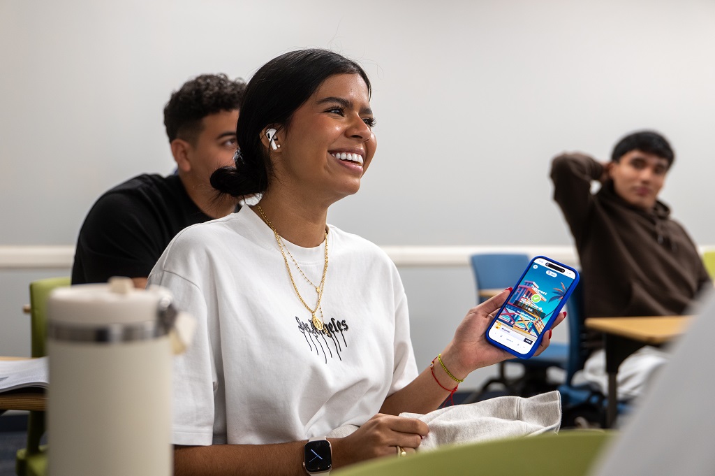 Student playing Kahoot! on a smartphone in a classroom