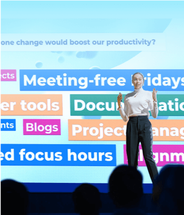 Female presenter on stage at an event