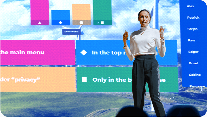 Female presenter standing on stage in front of a large screen displaying a kahoot