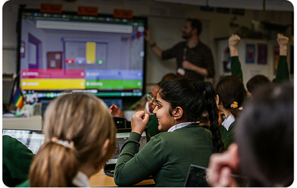 Classroom with children playing kahoot on a large screen