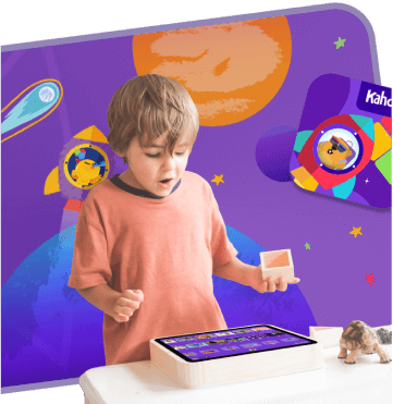 Young boy excitedly using a tablet device to learn using Kahoot!