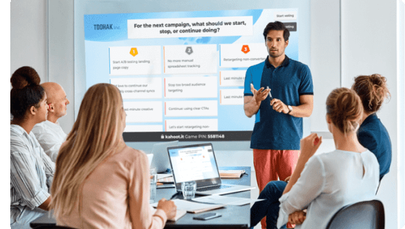 Man presenting using Kahoot! in front of small group